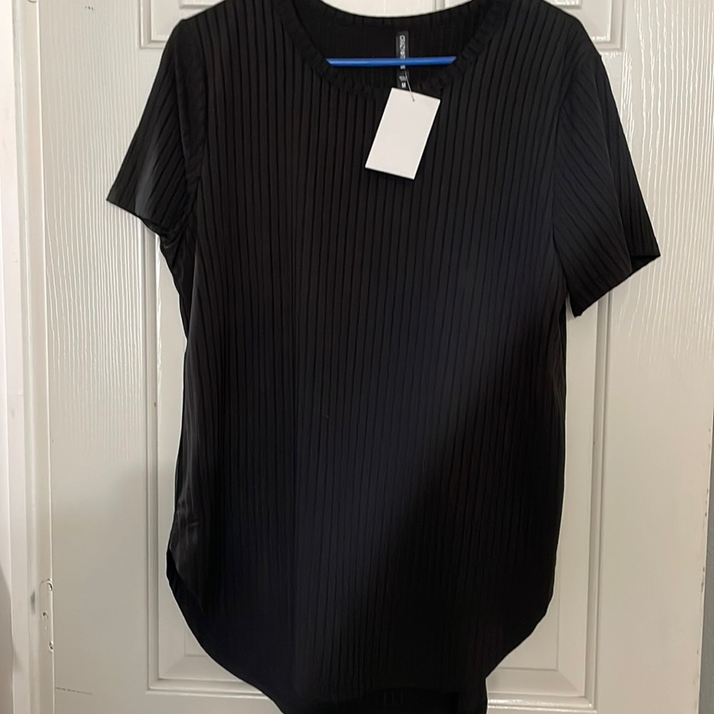Black top. Size med. never worn.